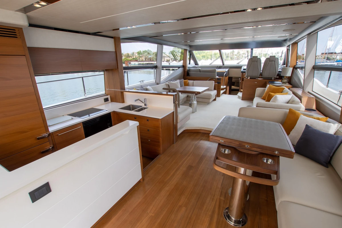 Luxurious interior of 2015 Princess 68 yacht with modern furnishings and panoramic windows.