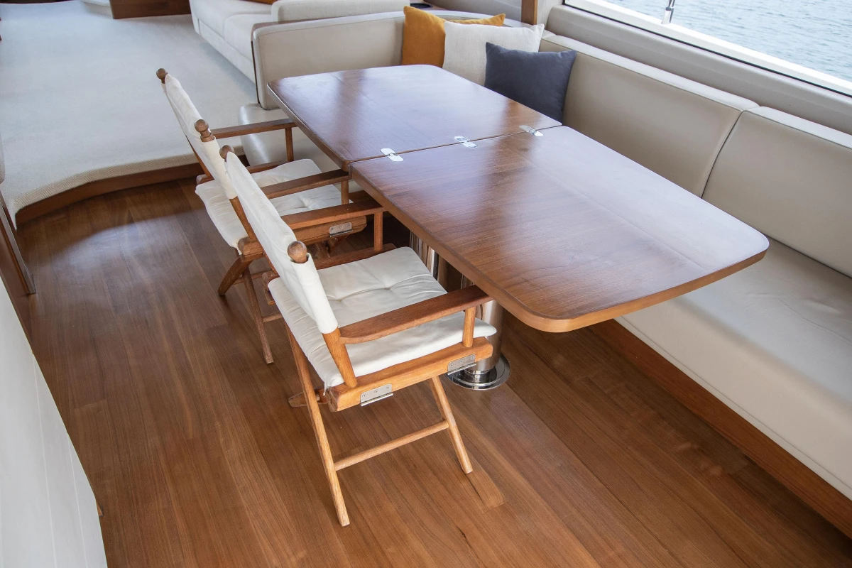 Luxurious interior of 2015 Princess 68 yacht with elegant dining area.