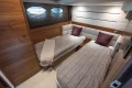 Luxurious twin cabin interior of 2015 Princess 68 yacht with modern design elements.