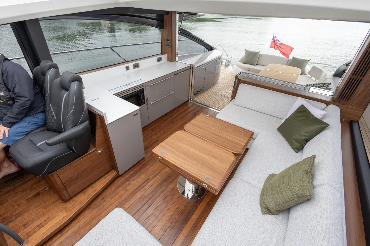 Luxurious interior of 2025 Princess V55 yacht with elegant seating and modern design.