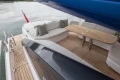 Luxurious 2025 Princess V55 yacht deck with elegant seating and wooden table.