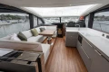 Luxurious interior of 2025 Princess V55 yacht with modern kitchen and seating area.