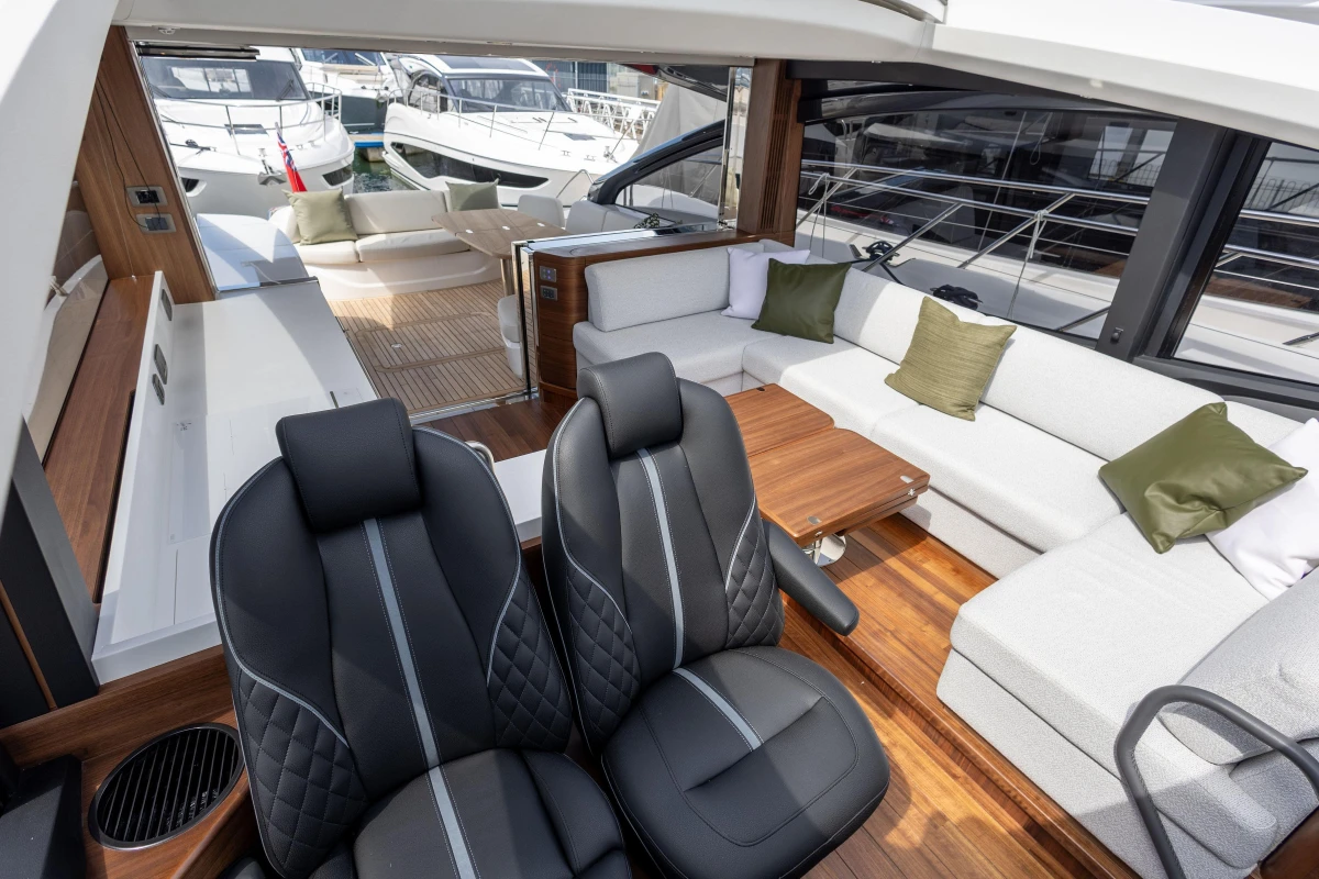 Luxurious 2025 Princess V55 yacht interior with elegant seating and modern design.