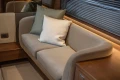 Luxurious interior seating on 2025 Princess V55 yacht with plush cushions and elegant design.