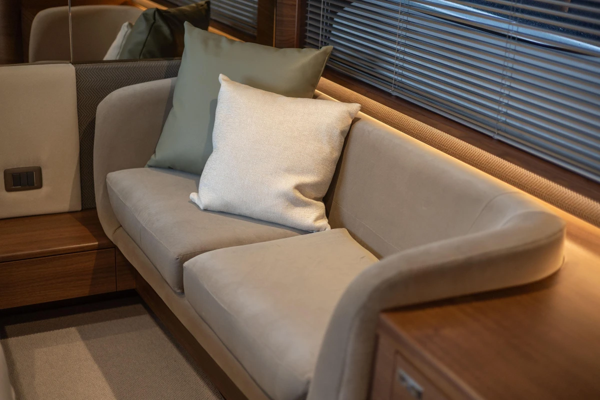 Luxurious interior seating on 2025 Princess V55 yacht with plush cushions and elegant design.