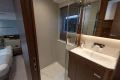 Luxurious bathroom interior of 2025 Princess V55 yacht, featuring modern sink and elegant design.