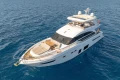 Luxury 2017 Princess 68 yacht cruising on open blue sea.