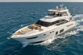 Luxurious 2017 Princess 68 yacht cruising on open sea under clear skies.