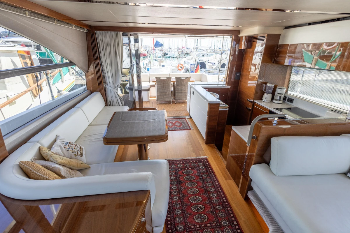 Luxurious interior of 2017 Princess 68 yacht with elegant seating and dining area.