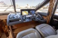 Luxurious 2017 Princess 68 yacht cockpit with modern navigation system and leather seating.