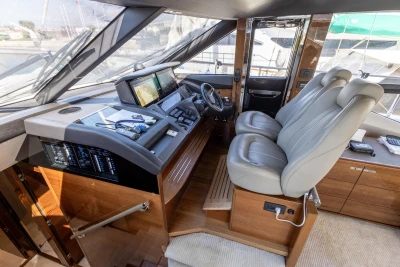 Luxurious 2017 Princess 68 yacht cockpit with modern navigation equipment and plush seating.