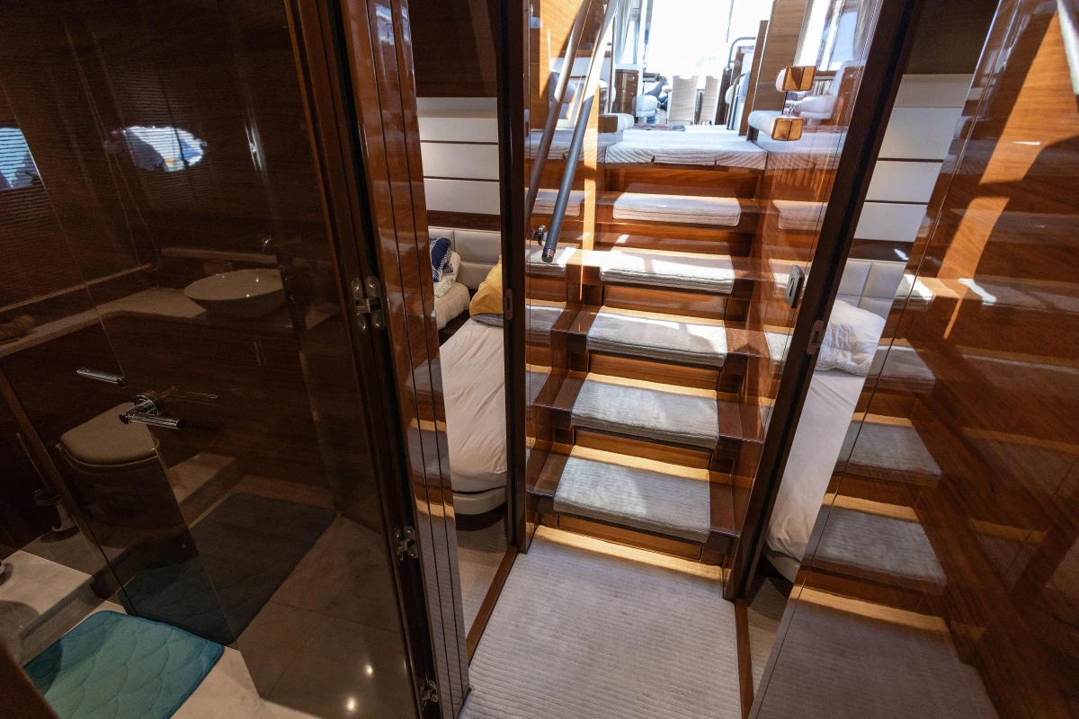 Luxurious interior of 2017 Princess 68 yacht with wooden finishes and elegant design.