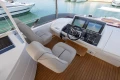 Luxurious helm of 2017 Princess 68 yacht with dual seats and navigation screens.
