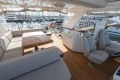 Luxurious 2017 Princess 68 yacht interior with elegant seating and wooden deck.