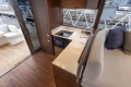 Interior of Princess F50 yacht, modern kitchen and seating area.