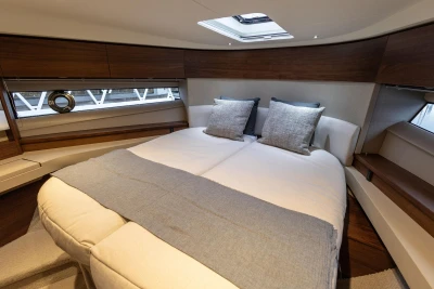 Luxurious bedroom on the 2025 Princess F50 yacht.