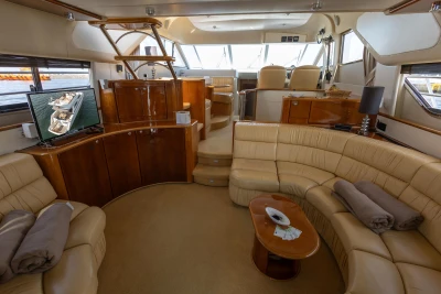 Luxurious interior of a 1995 Princess 60 yacht with leather seating and modern amenities.
