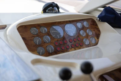 Dashboard of a 1995 Princess 60 yacht with gauges and controls.