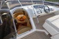 Luxurious 1995 Princess 60 yacht interior with elegant seating and modern helm controls.