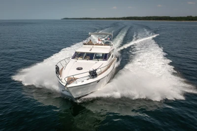 Luxury Princess 60 yacht cruising on open water, 1995 model.