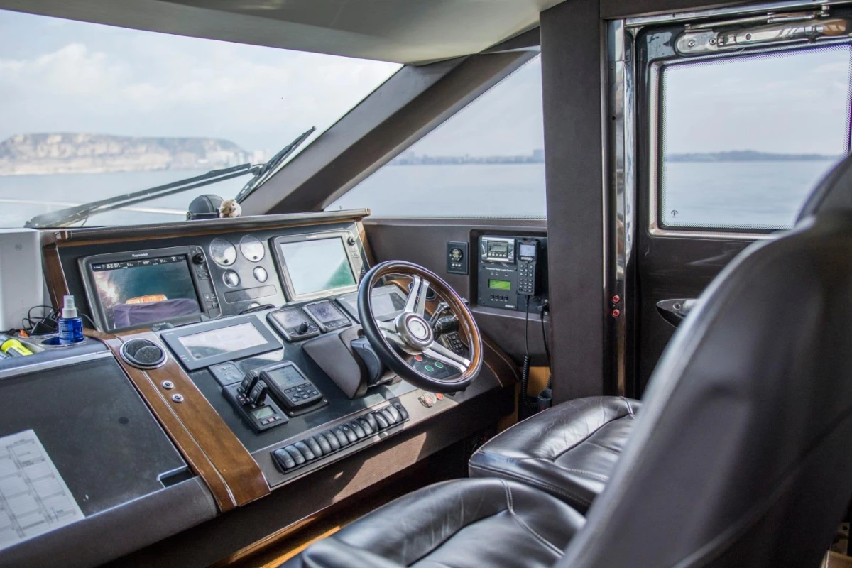 Interior helm of 2013 Princess 72 Motor Yacht with advanced navigation controls.