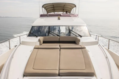 2013 Princess 72 Motor Yacht cruising with sunbathing deck, ocean view.