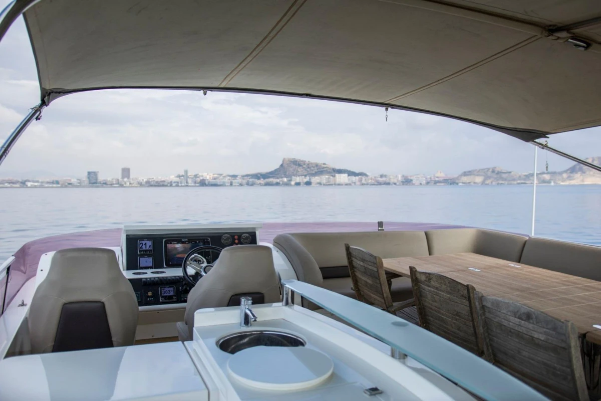 2013 Princess 72 Motor Yacht interior with helm, seating, and ocean view.
