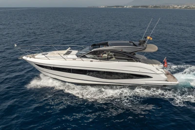 2023 Princess V50 Open yacht cruising on open sea, side view.