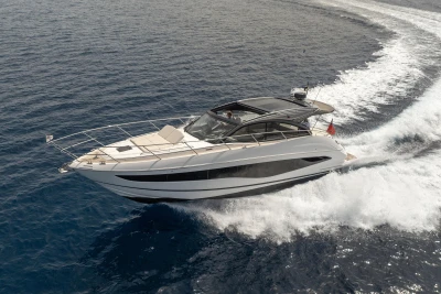 2023 Princess V50 Open yacht cruising on open water, creating a dynamic wake.
