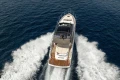 2023 Princess V50 Open yacht cruising on open sea, aerial view.