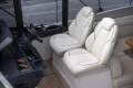 Luxurious interior of 2023 Princess V50 Open yacht with plush white seating.
