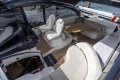 Luxurious interior of 2023 Princess V50 Open yacht with elegant seating and wooden flooring.