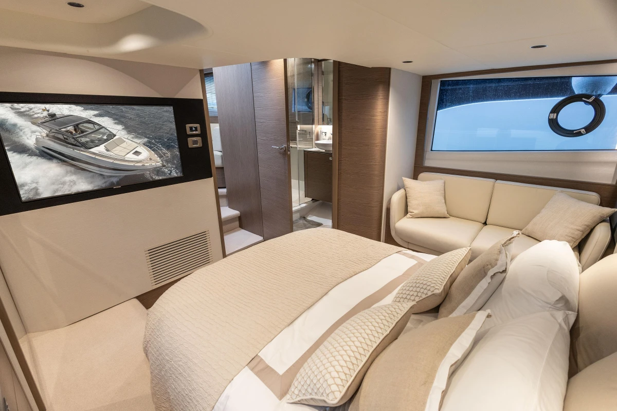 Luxurious interior of 2023 Princess V50 Open yacht with cozy bedroom and modern amenities.