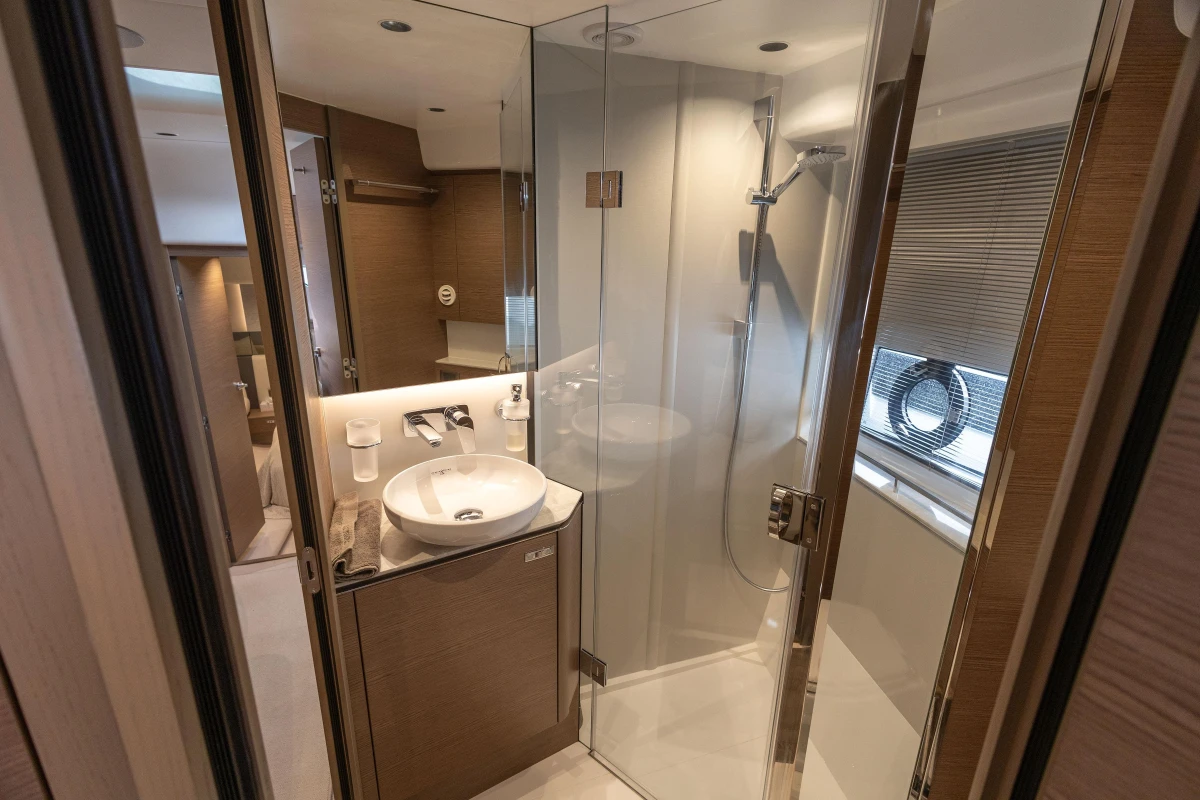 Luxurious bathroom in 2023 Princess V50 Open yacht, featuring modern shower and elegant sink.