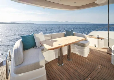 Luxurious 2025 Princess F65 yacht deck with elegant seating and ocean view.