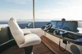 Luxurious 2025 Princess F65 yacht helm with modern controls and ocean view.