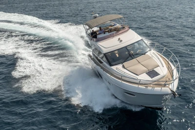 Luxurious 2018 Princess 49 yacht cruising on open sea, showcasing elegance and performance.