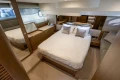 Luxurious bedroom interior of 2018 Princess 49 yacht with elegant decor and comfortable bedding.