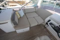 Luxurious seating area on 2018 Princess 49 yacht with cushions and control panel.