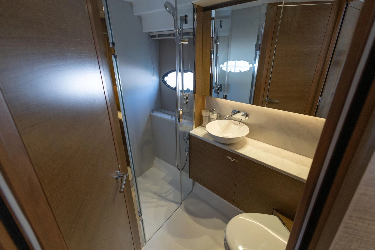 Luxurious bathroom in 2018 Princess 49 yacht with modern fixtures and wooden accents.