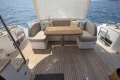 Luxurious 2018 Princess 49 yacht deck with elegant seating and ocean view.
