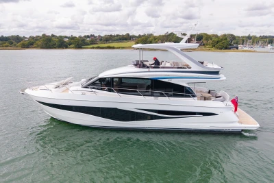 Luxury 2025 Princess F58 yacht cruising on calm waters, showcasing sleek design and elegance.