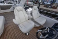 Luxurious 2025 Princess F58 yacht interior with elegant white seating and wooden flooring.