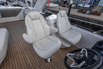 Luxurious 2025 Princess F58 yacht interior with elegant white seating and wooden flooring.