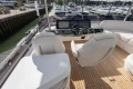 Luxurious 2025 Princess F58 yacht cockpit with modern steering and plush seating.