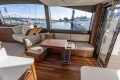 Luxurious interior of 2025 Princess F58 yacht with elegant seating and wooden finishes.