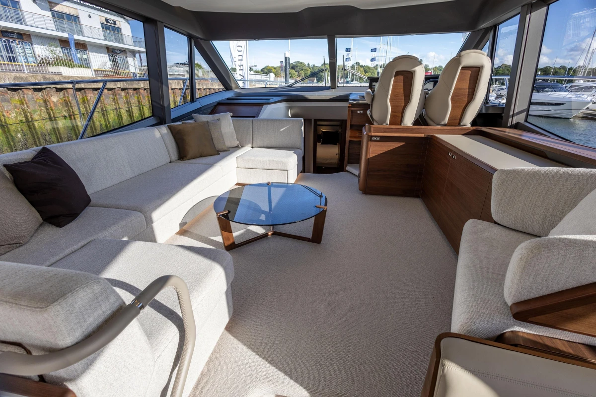 Luxurious interior of 2025 Princess F58 yacht with elegant seating and modern design.
