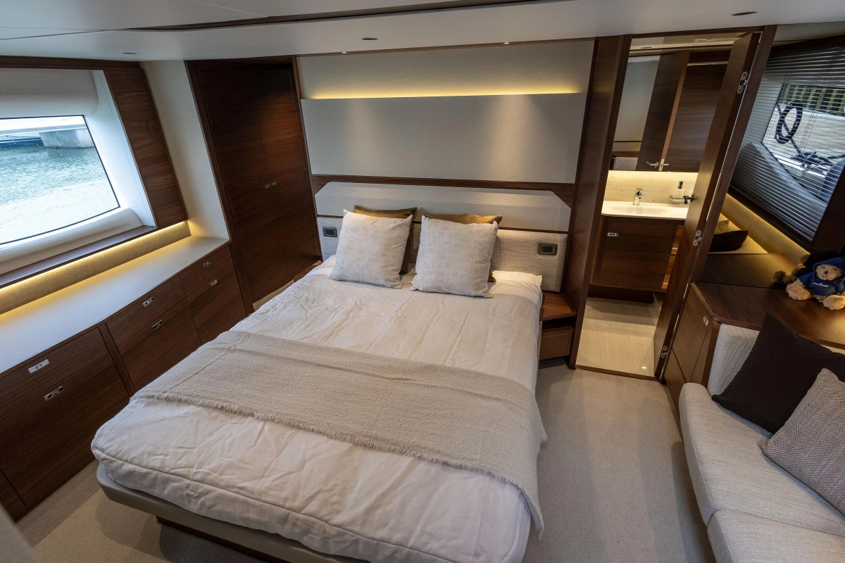 Luxurious 2025 Princess F58 yacht bedroom with modern design and elegant furnishings.