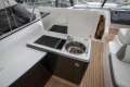 2017 Princess V48 Open yacht kitchenette with sink and grill on teak deck.