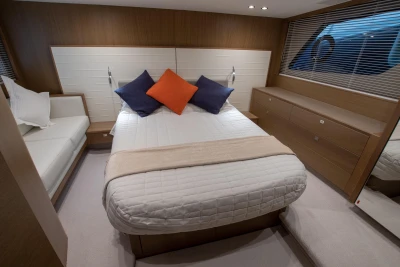Luxurious bedroom interior of 2017 Princess V48 Open yacht with modern decor.